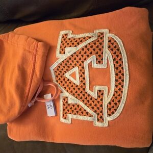 Orange Hoodie with Heart Pattern Logo